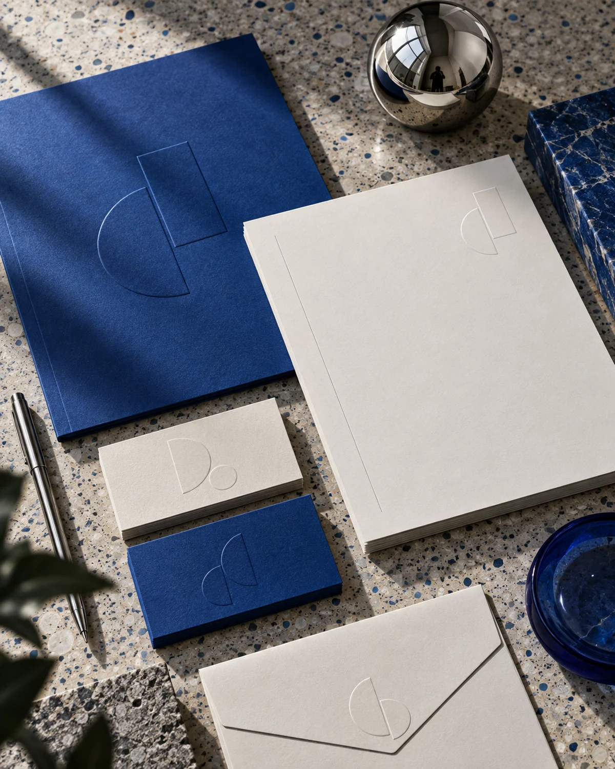 Architecture stationery arranged on blue terrazzo